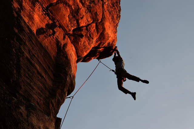 Discipline of progress not perfection illustrated by a person climbing upward toward light