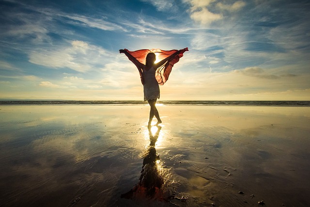 person standing at sunrise symbolizing hopeful strength in hard seasons